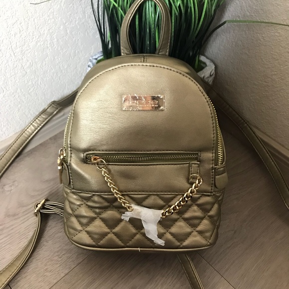 bebe Handbags - NWT BeBe Gina Mini backpack (bronze)